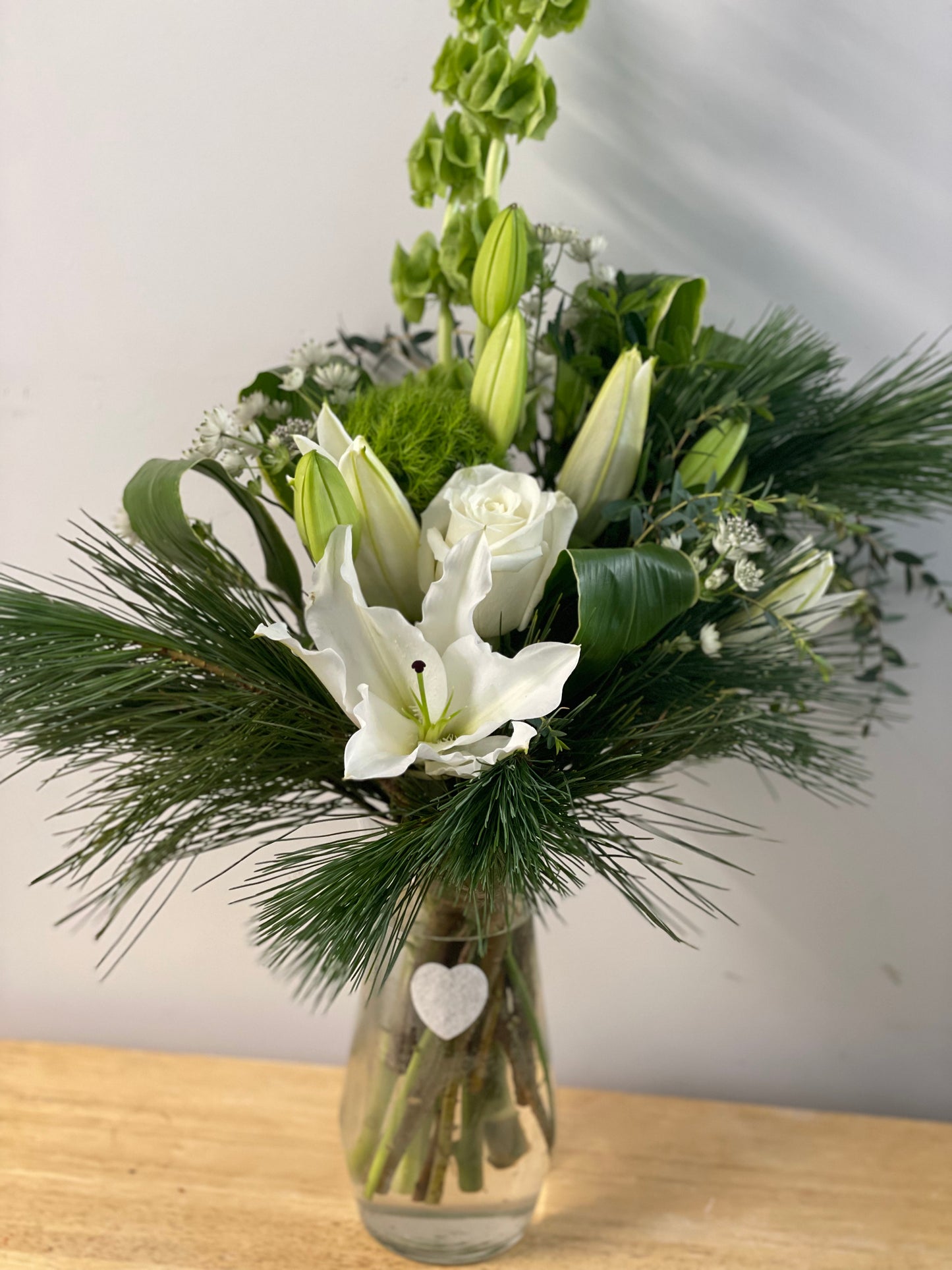 Vased sympathy arrangement