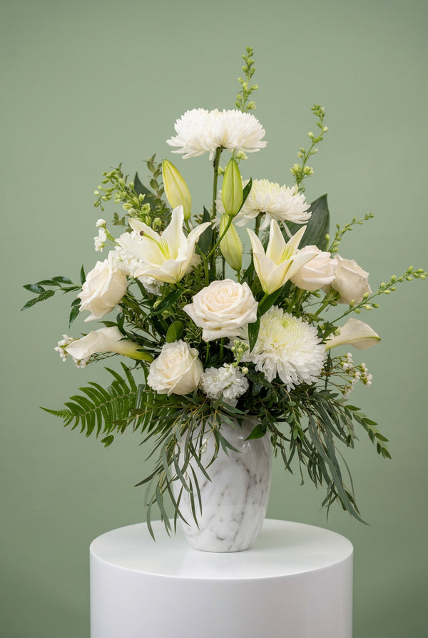 A thoughtful sympathy flower arrangement designed to express your deepest condolences during difficult times. This contemporary funeral and sympathy arrangement offers a beautiful way to share your heartfelt sympathies, offer comfort and show you care.

Boy O Boy Flowers by Nikolle is your local Okotoks florist, offering fresh sympathy flowers and funeral flowers with delivery to residential homes, as well as Snodgrass Funeral Homes in both Okotoks and High River. Available in surrounding areas including Se