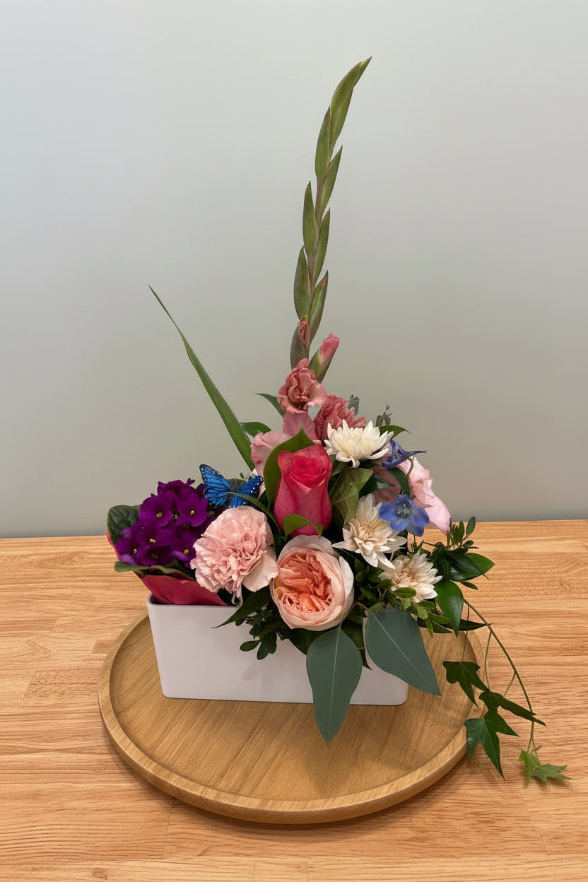 Bloom & Grow - Best of Both World: A flowering potted plant in a flower arrangement